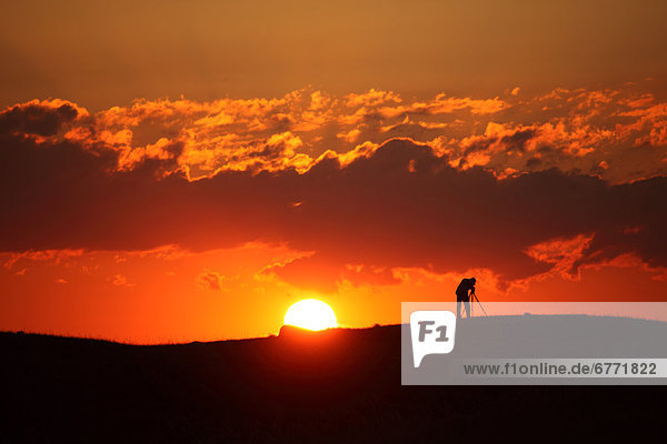 Silhouette of a photographer at sunset  Saskatchewan