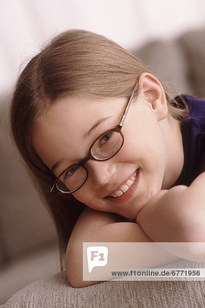 Portrait of a young girl wearing glasses