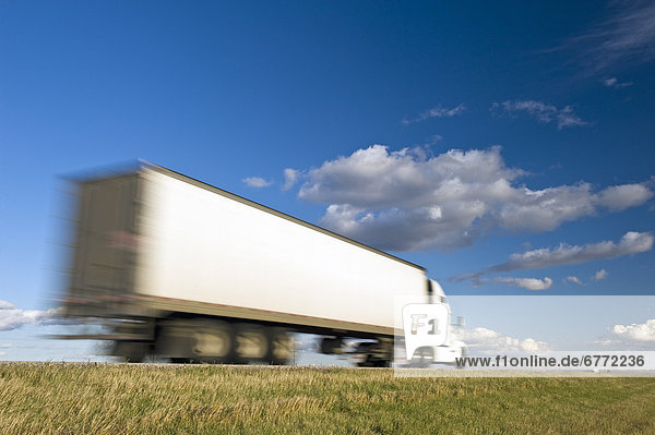 Moving transport truck on Trans-Canada Highway  near Winnipeg  Manitoba