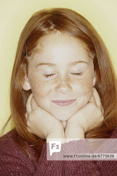 Young girl with her eyes closed