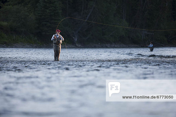 Canada  British Columbia  Fernie  Woman fly fishing in river