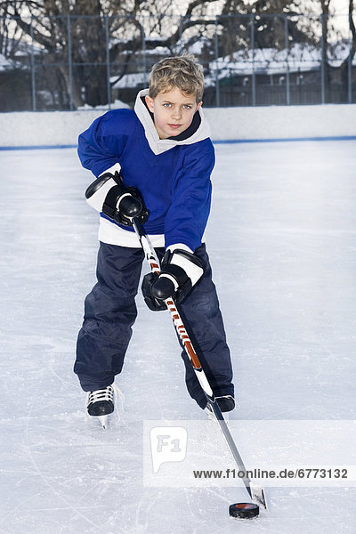 Young hockey player on an outdoor rink  Toronto  Ontario