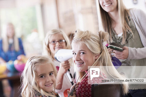 USA  Utah  family portrait of sisters (6-7  8-9  12-13  14-15  16-17) preparing hairs and having fun