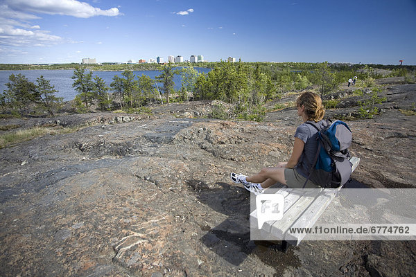 Hiker overlooking the skyline of Yellowknife  Northwest Territories