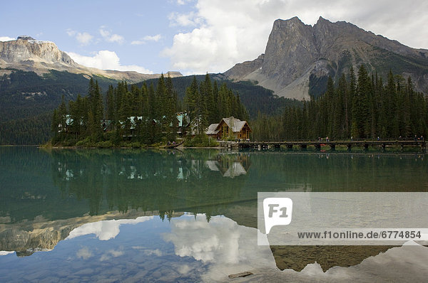 Rocky Mountains  cabins and pier reflecting in the water  Emerald Lake  Yoho National Park  British Columbia