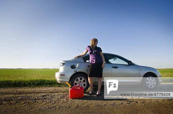 Businesswoman Stranded on a Dirt Road in need of Gas  East Regina  Saskatchewan