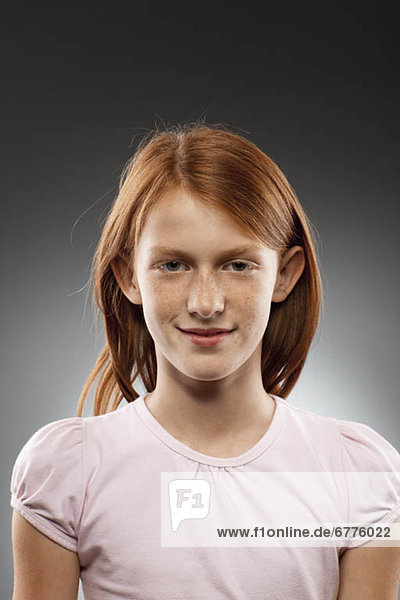 Portrait of redhead girl (10-11)  studio shot