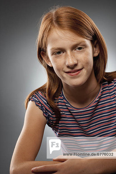Portrait of redhead girl (10-11)  studio shot