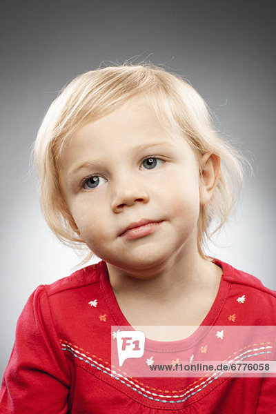 Studio portrait of girl (2-3) with blonde hair