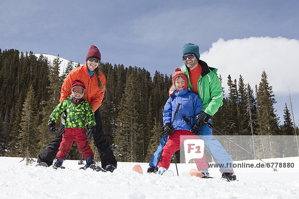 USA  Colorado  Telluride  Family skiing together