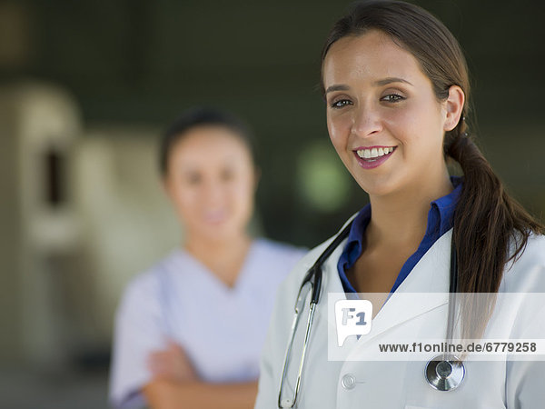 Portrait of female doctor  healthcare worker in background