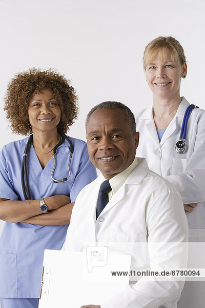 Portrait of three medical professionals  studio shot