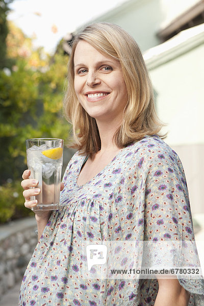Pregnant woman enjoying non alcoholic drink