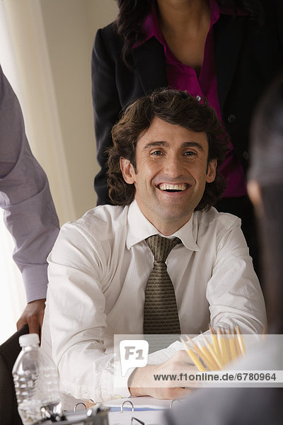 Portrait of smiling businessman in office