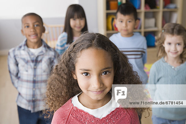 Smiling children (6-7) in classroom