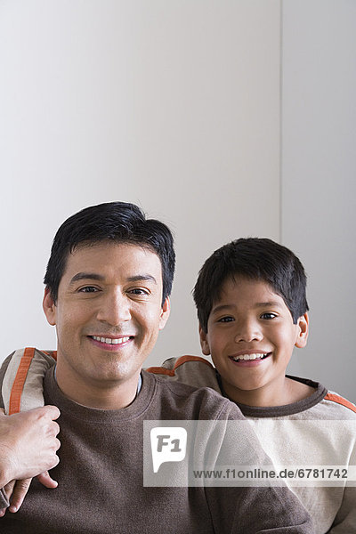 Portrait of smiling father and son (10-11)
