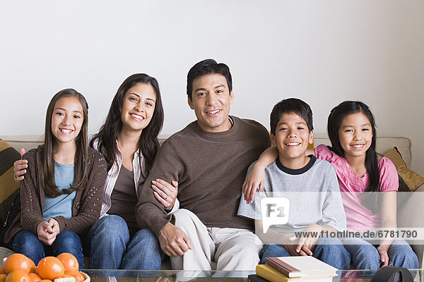 Portrait of happy family with three children (8-9  10-11)