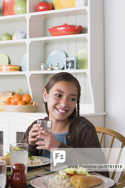 Portrait of smiling girl (  10-11) at table