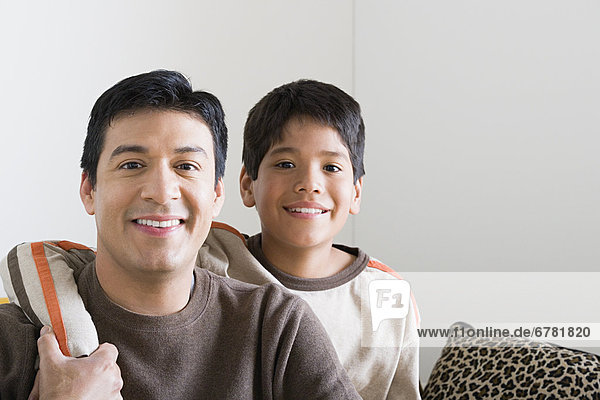Portrait of smiling father and son (10-11)