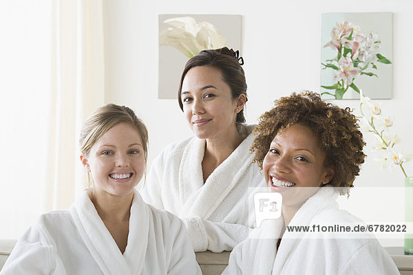 Portrait of three attractive women relaxing in spa
