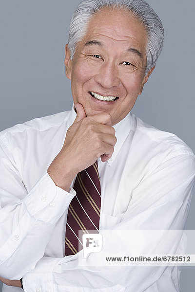 Portrait of happy senior businessman