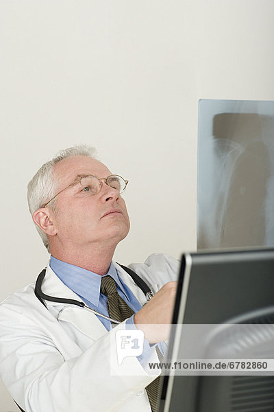 Doctor looking at x-ray image