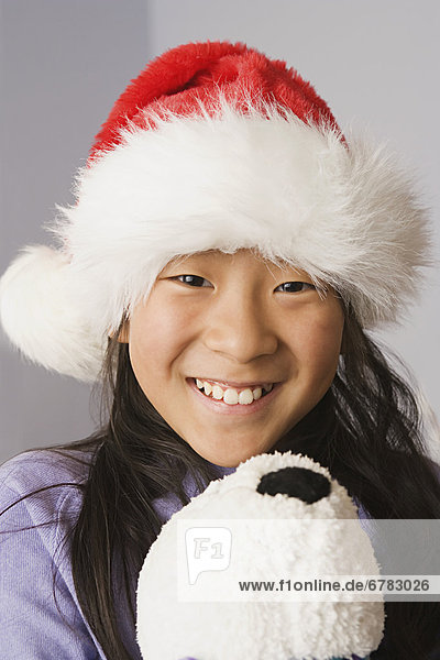 Portrait of girl wearing santa hat