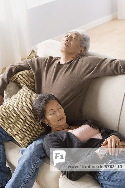 Portrait of couple resting on sofa