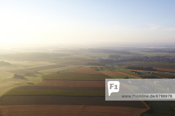 Field landscape with village in the background  Baden-Wuerttemberg  Germany  aerial photo