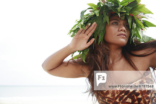 Hawaii  Oahu  Polynesian female posing wearing wild fern haku and tapa cloth