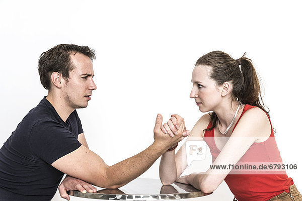 Man and woman arm wrestling  woman winning  symbolic image for the battle of the sexes