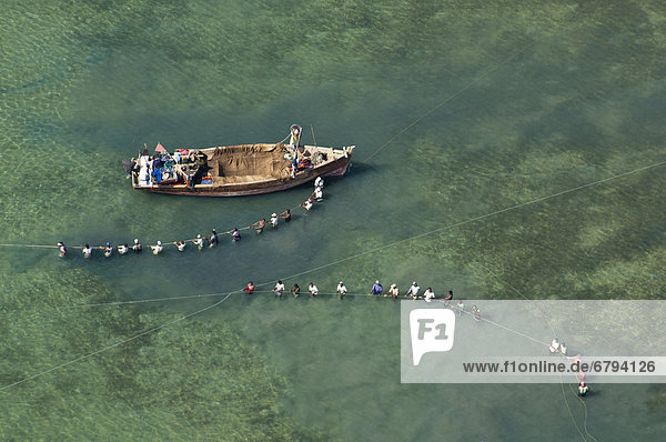 Aerial view  fishermen with boats and nets off the coast of Bagamoyo  Pwani Region  Tanzania  Africa