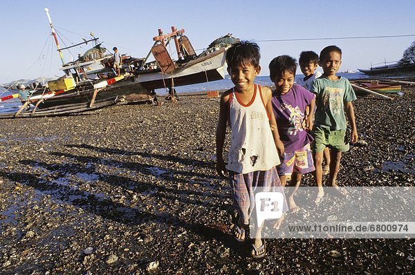 Children On Rocky Beach  Bais  Negros Island  Philippines