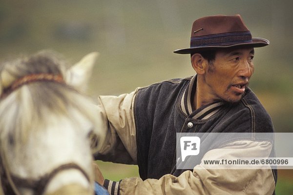 Man With Horse  Jakar  Bhutan