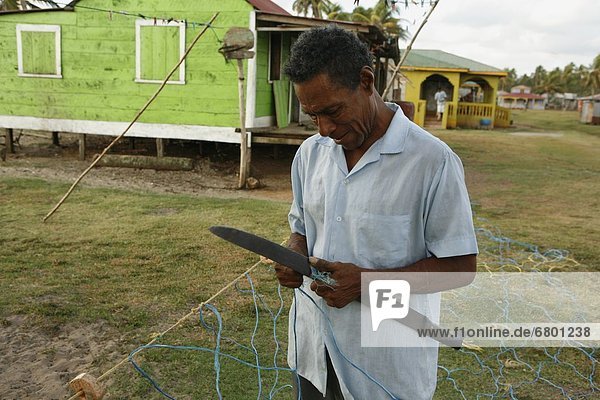Man Repairing Fishing Net  Tasbapauni  Nicaragua