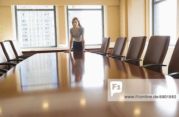 Businesswoman standing in board room