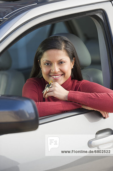 Woman sitting in her new car
