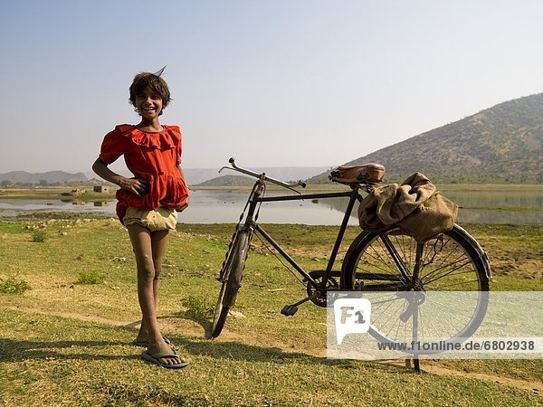Girl Standing By A Bicycle  Rajasthan  India