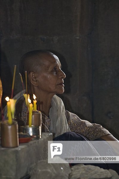 Siem Reap Cambodia Nun In Prayer At Angkor Wat Temple