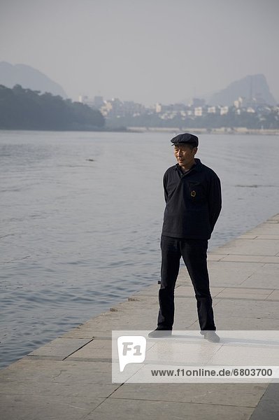Man Standing By Li River