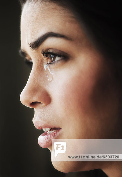 Close-up of young woman crying