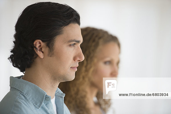 Profile of couple with focus on man in foreground