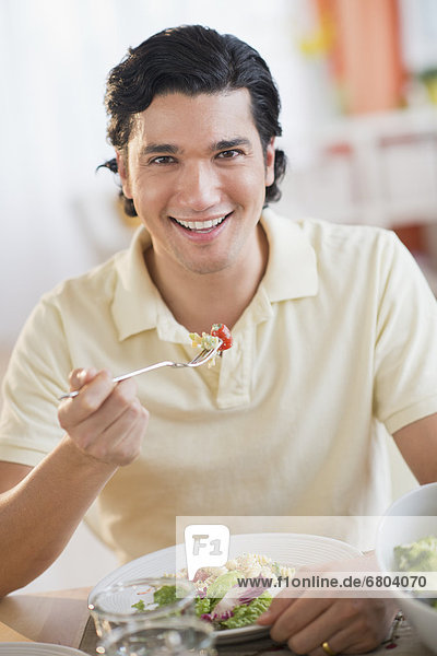 Portrait of man eating dinner