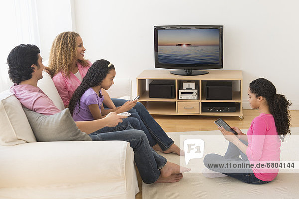 Parents with daughters (10-13) watching tv