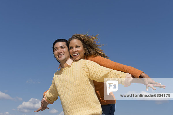 Couple under blue sky