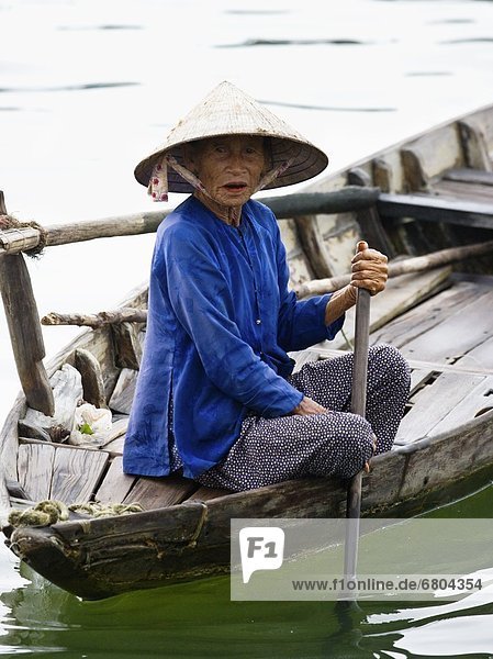 Woman On A Small Boat In Vietnam