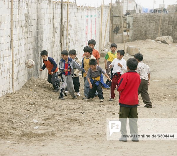 Young Boys Playing Soccer  Lima  Peru