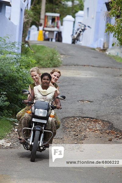 Three Young Women Riding A Motorized Scooter  Sathyamangalam  Tamil Nadu  India