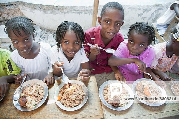 Children Eating A Hot Meal  Port-Au-Prince  Haiti