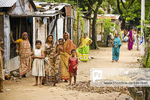 Women And Children Walking Down A Street In A Rural Village  Sylhet Bangladesh